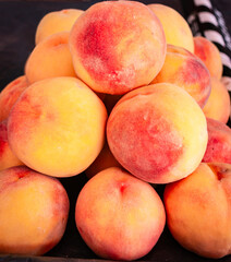 Ripe fresh peaches. Beautiful peaches. Close-up. Sale of peaches at the farmers' market.