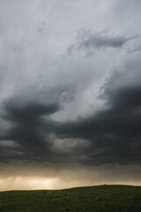 Obraz na płótnie Canvas Storm clouds over the field