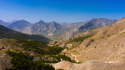 View from a high point on a mountain gorge. Aerial photography of mountains.