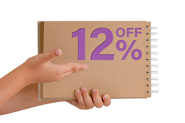 12 percent discount on isolate. Notepad from recycled paper in the hands of a child with text, sale up to 12 percent. The child is holding a notepad demonstrating a big sale.