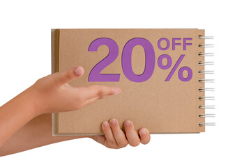 20 percent discount on isolate. Notepad from recycled paper in the hands of a child with text, sale up to 20 percent. The child is holding a notepad demonstrating a big sale.