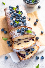 fresh blueberry loaf of bread muffin cake with mint closeup on a table