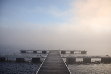 Fototapeta premium Morning mist on a Canadian lake in the province of Quebec