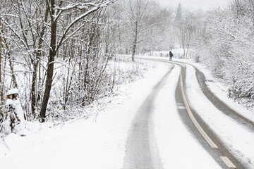 A woman on a snow-covered road