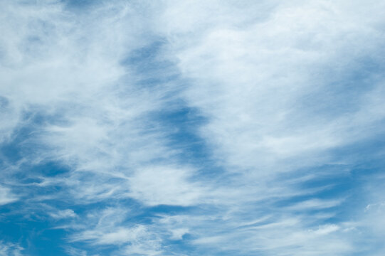 the sky, the photo shows a blue sky and clouds close-up, view from below