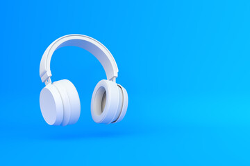 Wireless headphones in the air on a blue background. 3d rendering illustration