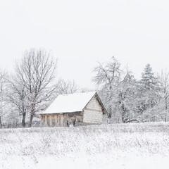 An old country house on a snow-covered hill