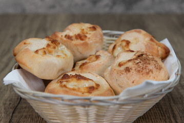 Full basket of garlic and cheese rolls makes the perfect appetizer before an Italian food meal