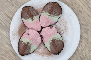 Overhead view of authentic Italian cuisine dessert of spumoni cut into quarters and presented...