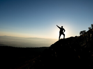 success and happiness of the mountaineer at the top