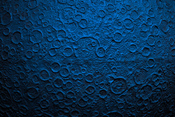 Surface of red planet with impact craters. Model of the far away cold planet in blue tone.