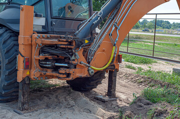Crawler excavator digging on demolition site. Excavating machine. Earth moving equipment. Excavation vehicle.