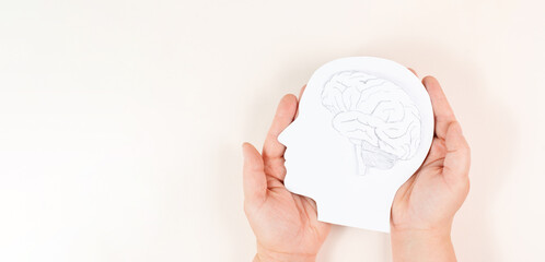 Holding a head with a brain in the hands, Parkinson disease, Alzheimer awardness, mental disorder...
