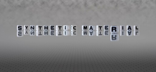 synthetic material word or concept represented by black and white letter cubes on a grey horizon background stretching to infinity