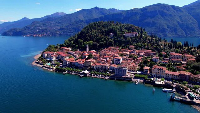 Aerial drone footage of Bellagio town lakefront on Lake Como Lombardy Italy. 4k cinematic overflight of beautiful colorful Italian borgo.  luxury travel resort and scenic destination.