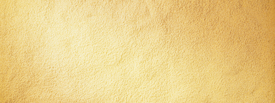 Sand background with copy space for text, banner. Sand texture closeup. Horizontal background pattern of sand beach