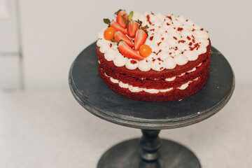Pastry chef makes delicious red velvet cake. Cooking and decorating dessert.