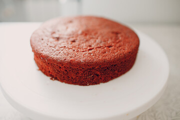 Pastry chef makes delicious red velvet cake. Cooking cake base.