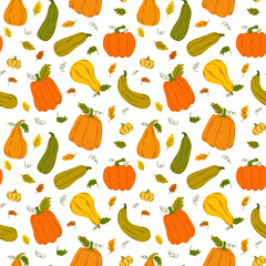 Seamless pattern of colorful pumpkins and leaves in flat style.
