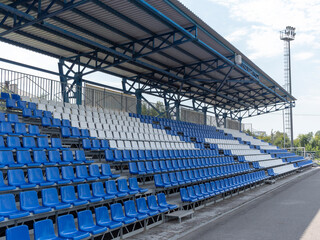 Naklejka premium Armchairs seats blue chairs at the sport stadium