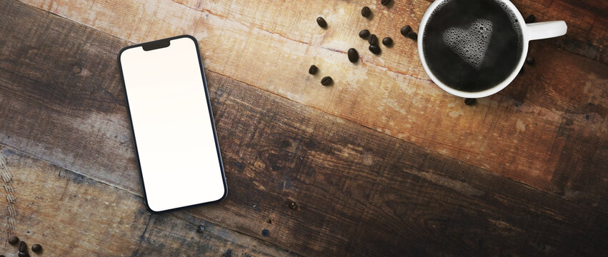 cell phone on a table with a cup of coffee transparent screen PNG - easy to modify - home office concept