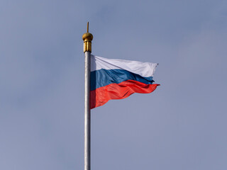 Russian flag fluttering in the wind on a flagpole