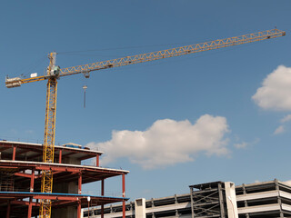 Construction site with many cranes against the sky