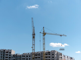 Fototapeta na wymiar Construction site with many cranes against the sky