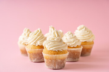 Vanilla cupcakes close up on white background