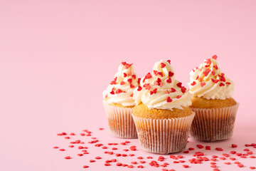 Vanilla cupcakes close up on with confectionery sprinkles