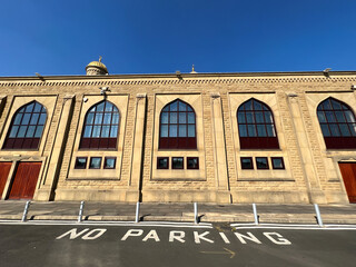 Fototapeta premium Side view of the, Bradford Central Mosque, with a No Parking sign nearby in, Bradford, Yorkshire, UK