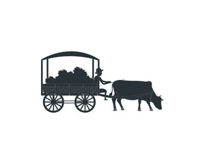 Fototapeta na wymiar Oxen pulling a huge load on a cart, farmer riding a bullock carts
