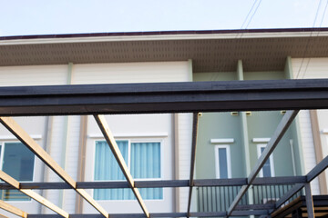 Fototapeta premium Steel roof structure. Build a room addition