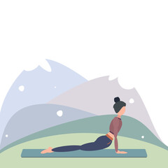 A woman practices yoga outdoors in Upward Facing Dog Pose, or Urdhwa Mukha Svanasana. Can be used for poster, banner, postcard.