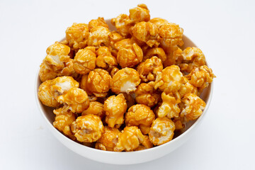 Honey caramel popcorn on white background.