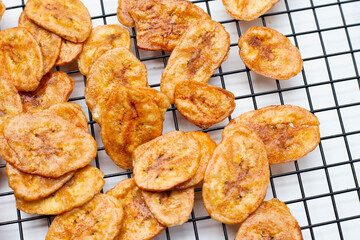 Banana chips on white background