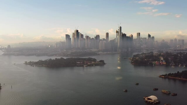 Aerial back flying from Sydney city CBD high-rise towers on Parramatta 4k.
