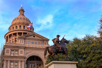 The Texas Capitol Building/ Texas Capitol and Ranger Statue/ The Texas Ranger statue in front of the Texas Capital building in Austin, TX © Tricia