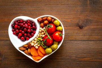 Diet cooking concept with healthy food in heart shaped plate