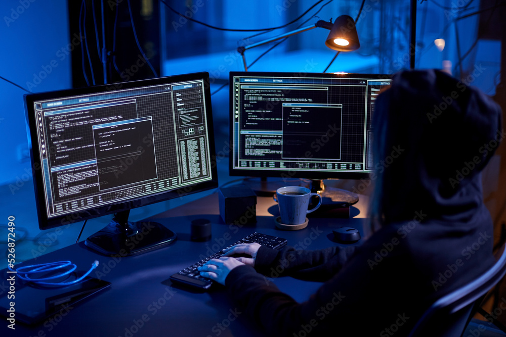 Poster cybercrime, hacking and technology concept - female hacker in dark room writing code or using comput