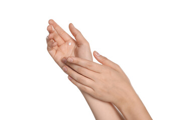 Woman applying cream on hand against white background, closeup