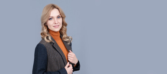 confident blonde woman in checkered english jacket, businesswoman. Woman portrait, isolated header banner with copy space.