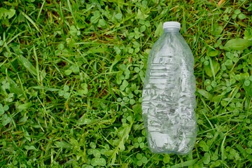 Plastic water bottles thrown on wooden floor concept campaign to separate plastic waste for recycling