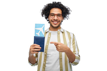 travel, tourism and people concept - smiling man with passport and air ticket over white background - obrazy, fototapety, plakaty