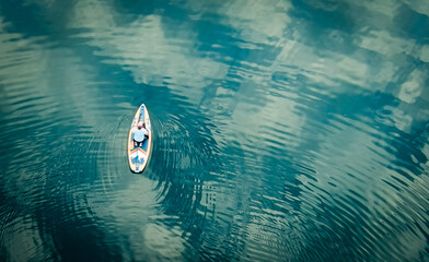 Paddler on Turquoise Water 