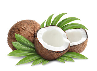 Tasty ripe coconuts and green leaves on white background