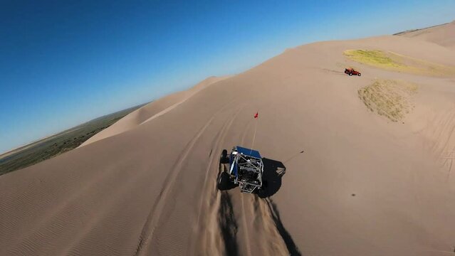 Dune Buggies Off-roading in the desert Sand Dunes