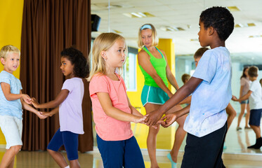 Little boys and girls dancing pair dance in the ballet studio. High quality photo