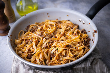 fettuccine ragu in frying pan