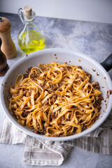 fettuccine ragu in frying pan